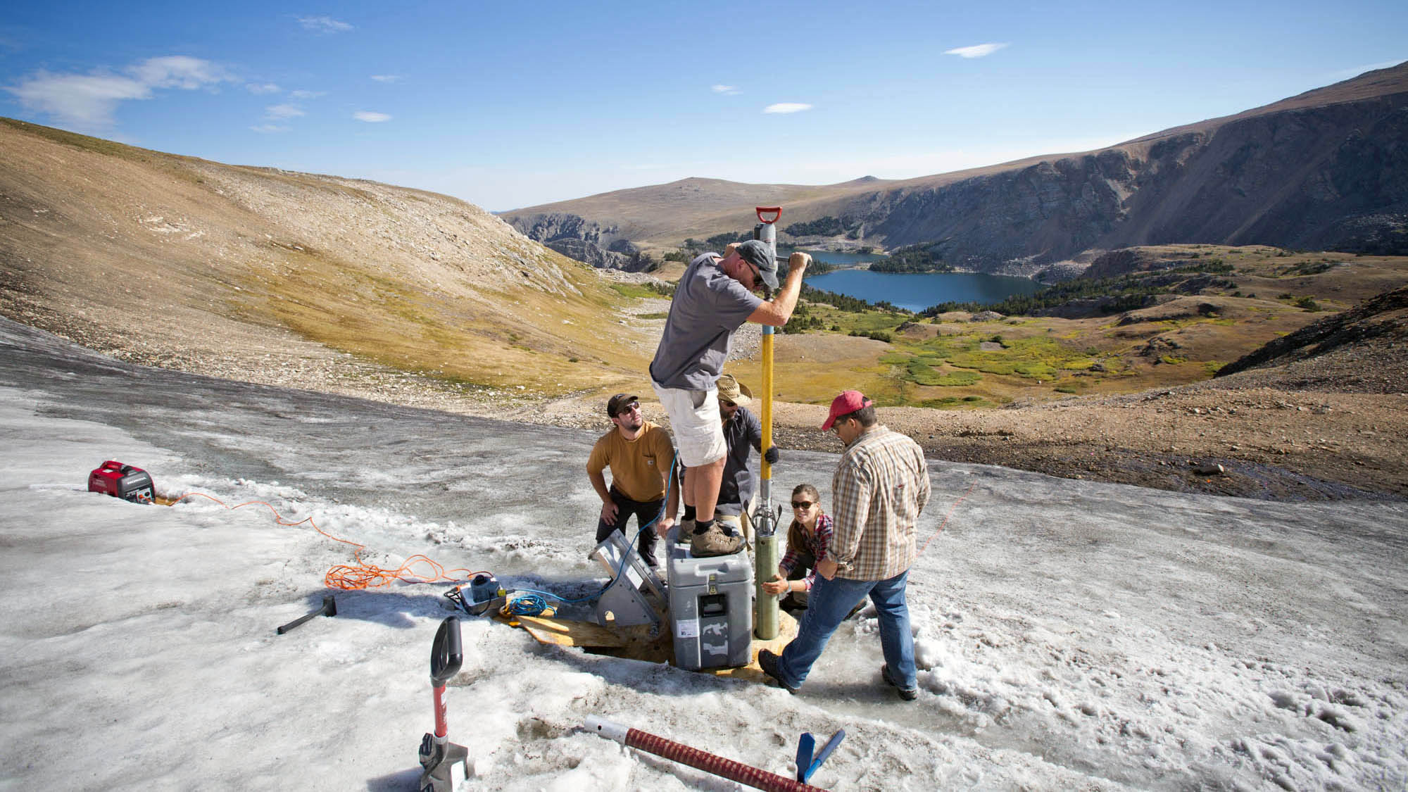 A field team led by Craig Lee (INSTAAR, UC-Boulder) and co-principal investigators David McWethy (Montana State University) and Greg Pederson (US Geological Survey) use the Prairie Dog Drill to recover a core from an ice patch in the Greater Yellowstone Area. Credit: Chris Boyer