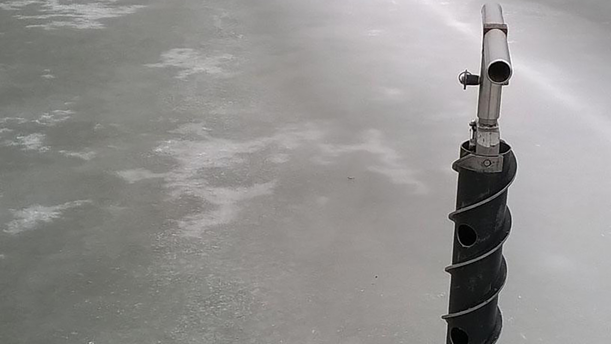 A SIPRE hand auger is used on an ice-covered northern U.S. temperate lake. Credit: Robert McKay