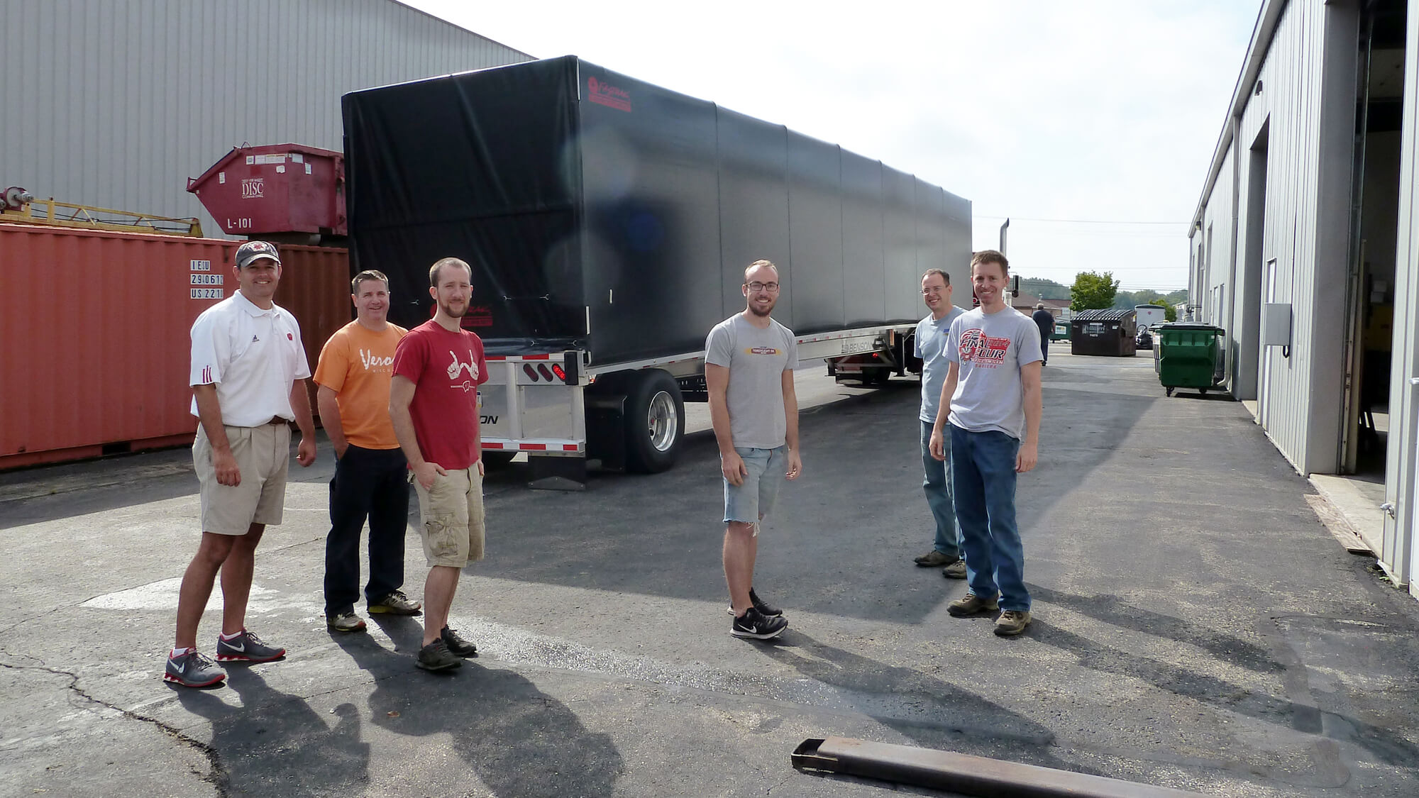 IDP-WI staff outside the IDP warehouse.