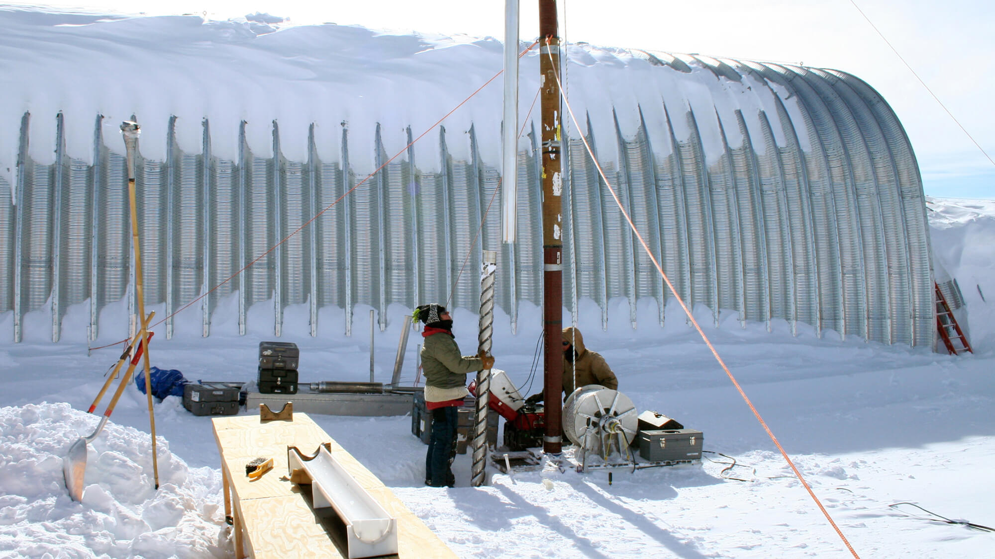 Beth Bergeron (left) and Michael Jayred (right) drilling a 130-meter deep ice core at WAIS Divide, Antarctica, during the 2006-2007 summer field season. Photo: Joseph Souney