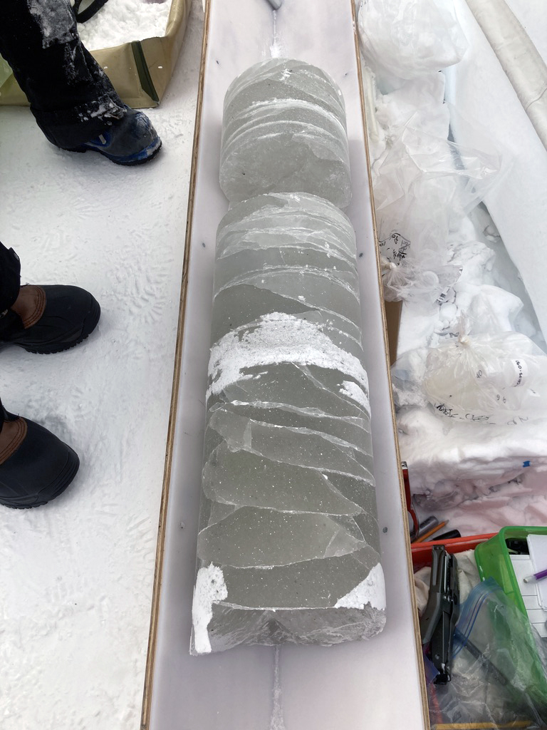 A greenish colored BID core recovered from the bottom of the 192 meter deep borehole. Credit: Elizabeth Morton.